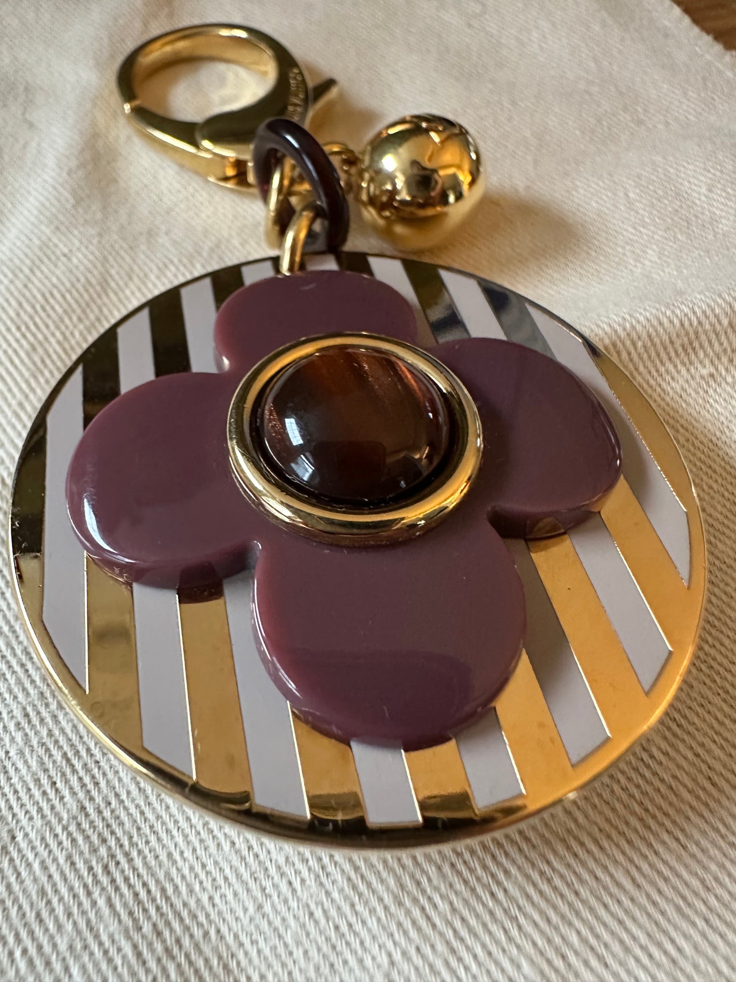 Louis Vuitton Idylle Blossom Bag Charm: in white, gold & plum.