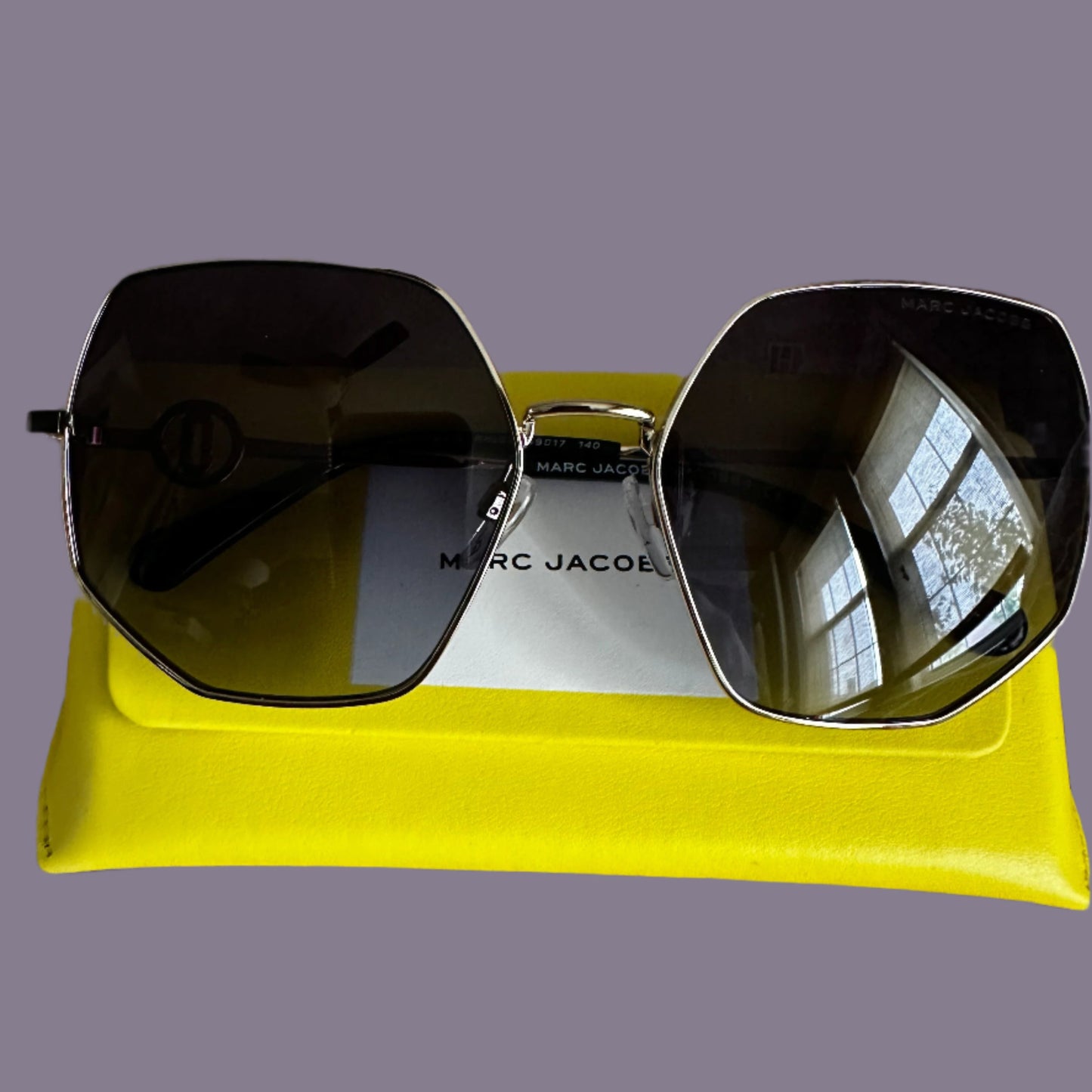 Marc Jacobs gold-rimmed oversized metal frames with MJ medallian on side