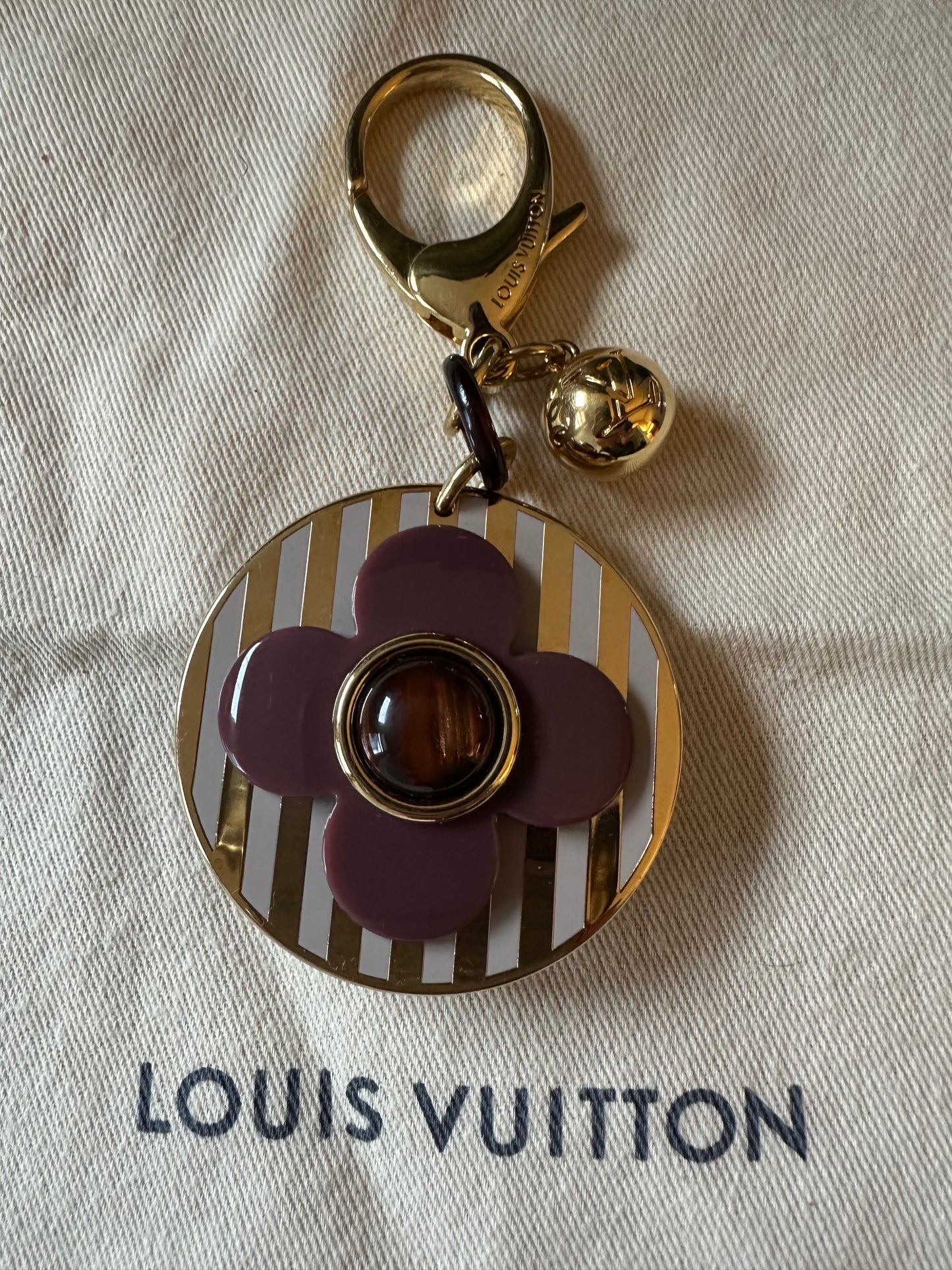 Louis Vuitton Idylle Blossom Bag Charm: in white, gold & plum.